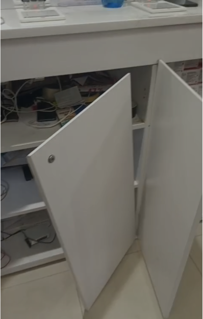 Before repair: retail display cabinet doors with damaged hinges
