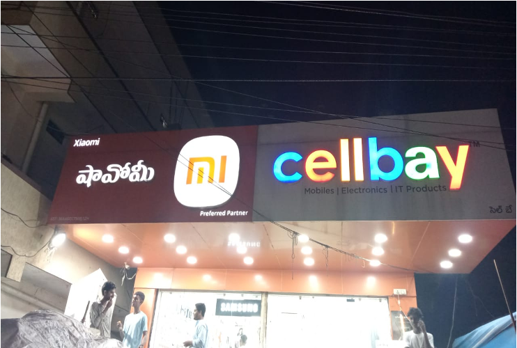 After repair: the storefront sign with its branding illuminated