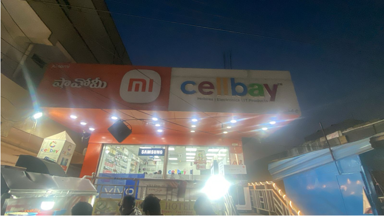 Before repair: the storefront sign is unlit above the shop entrance